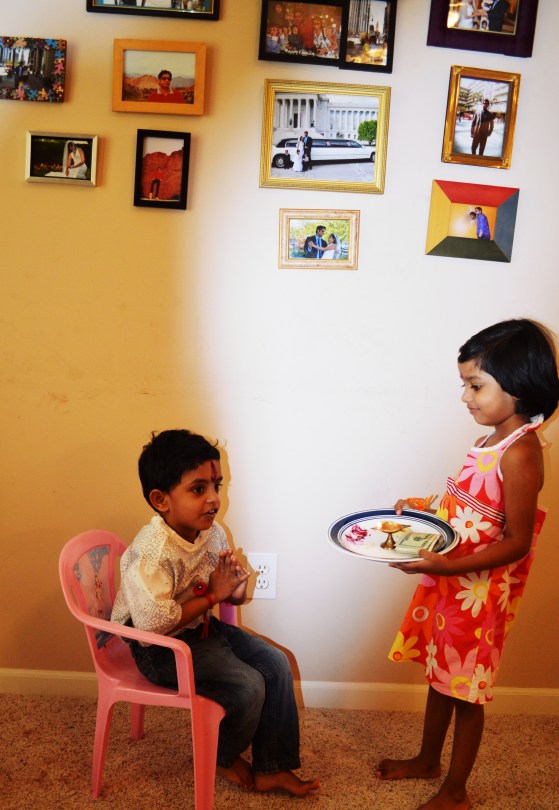 Tisha taking Aarti and Renne praying for Tisha's blessings