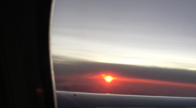 Silent Sunday – Rising Sun From Plane Window